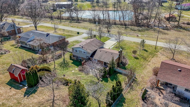 birds eye view of property with a water view and a residential view