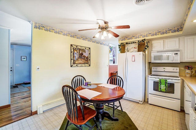 dining room with light floors, visible vents, a baseboard heating unit, a ceiling fan, and baseboards