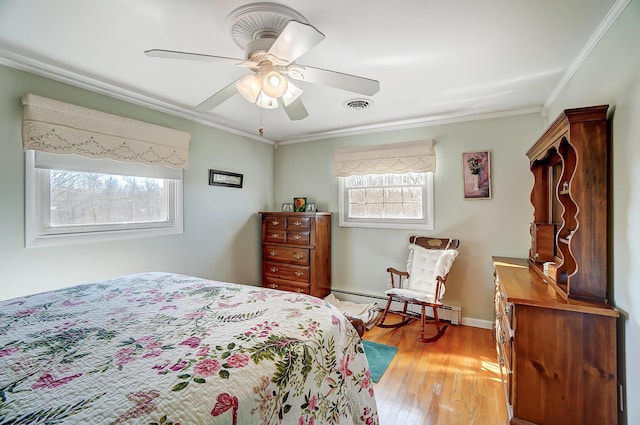 bedroom featuring a baseboard radiator, visible vents, a ceiling fan, ornamental molding, and light wood-type flooring