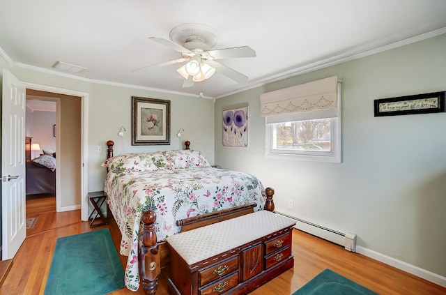 bedroom featuring visible vents, a baseboard radiator, light wood-style flooring, and crown molding