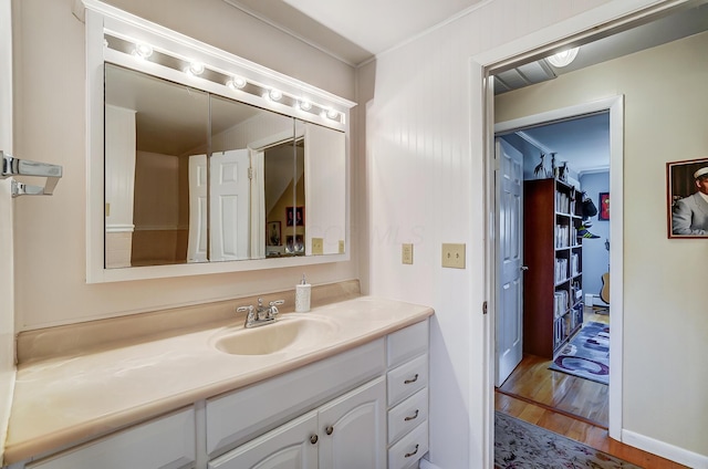 bathroom with vanity and wood finished floors