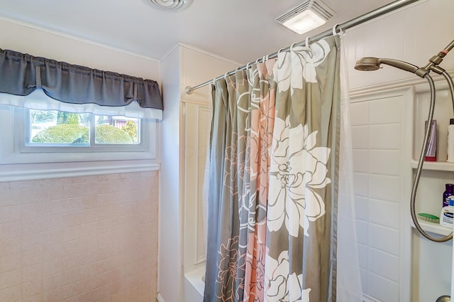 full bath with shower / bath combination with curtain and visible vents