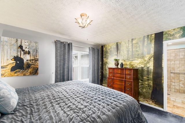 carpeted bedroom with wallpapered walls and a textured ceiling