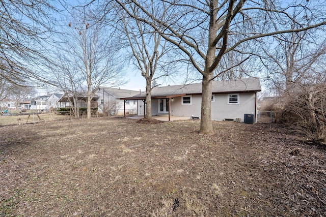 back of house featuring central AC, a patio area, and fence