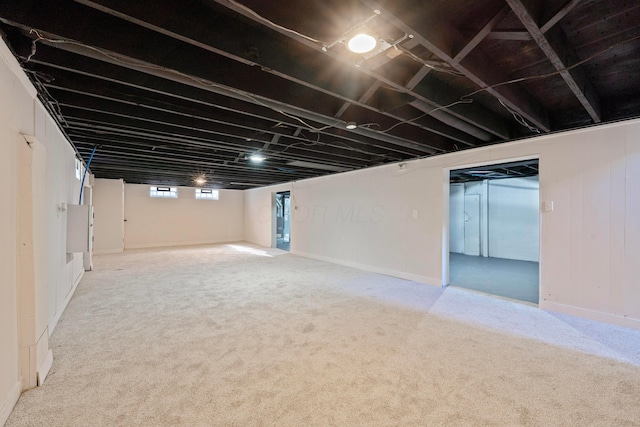 basement featuring carpet flooring