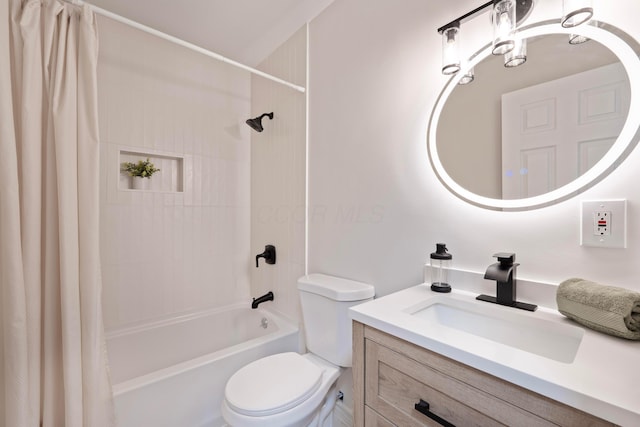 bathroom featuring vanity, toilet, and shower / bath combo with shower curtain