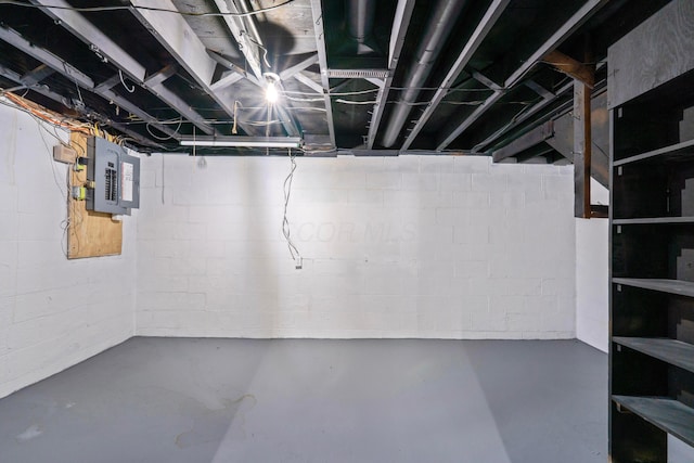 unfinished basement featuring electric panel