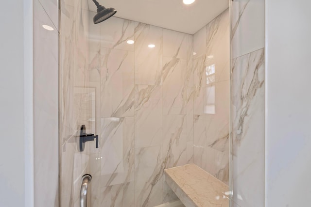 full bath featuring a marble finish shower