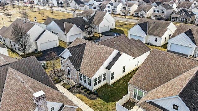 birds eye view of property with a residential view