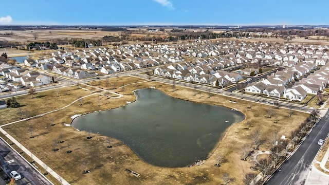 birds eye view of property featuring a residential view and a water view