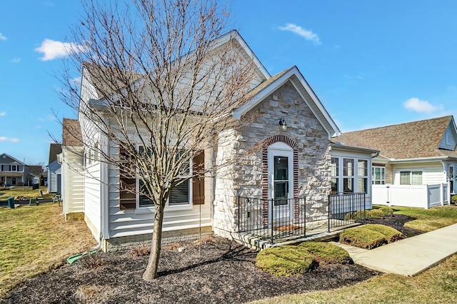 view of front facade featuring stone siding