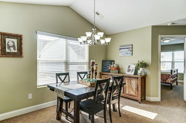 dining space featuring light carpet, lofted ceiling, visible vents, and a notable chandelier