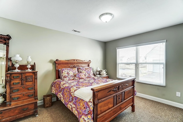 bedroom featuring carpet floors, baseboards, and visible vents