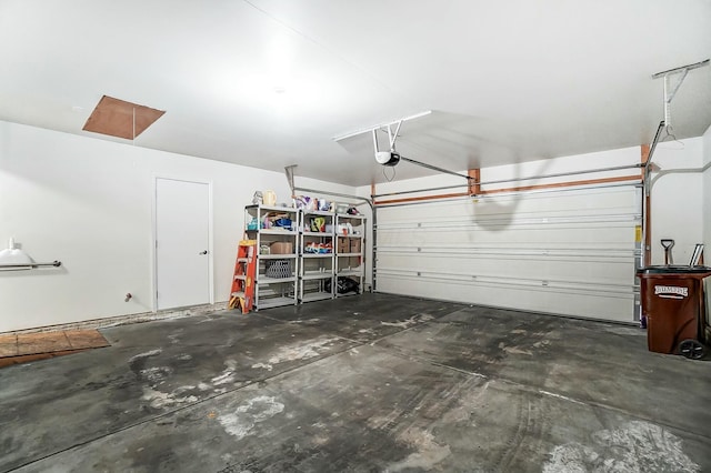 garage featuring a garage door opener