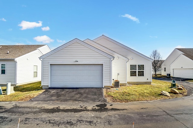 view of front of house with a garage and aphalt driveway