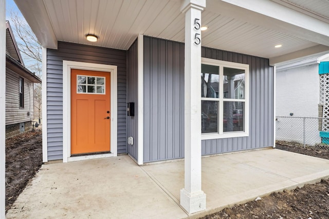 doorway to property with board and batten siding