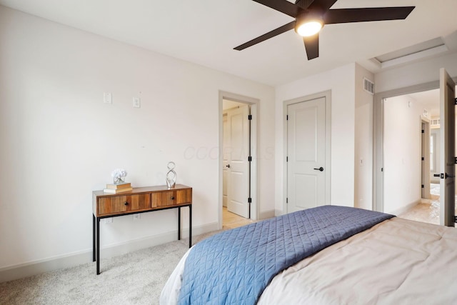 bedroom featuring ceiling fan, light carpet, visible vents, baseboards, and attic access