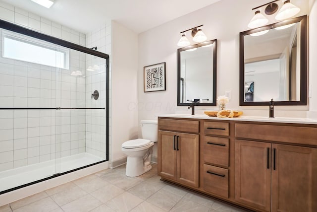 bathroom featuring tile patterned flooring, a sink, toilet, and a shower stall