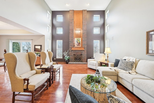 living area with a fireplace and wood finished floors