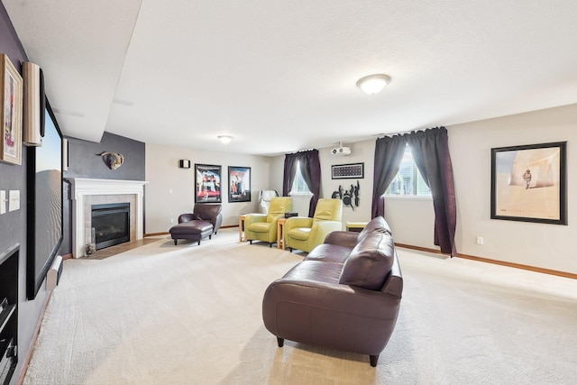 living area featuring carpet, baseboards, and a tiled fireplace