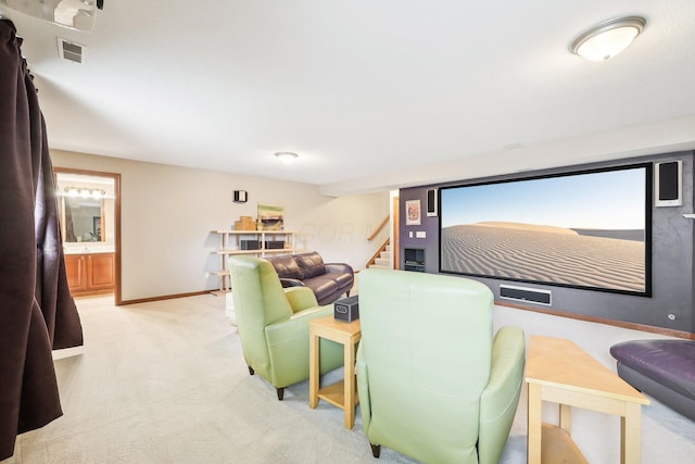 carpeted home theater room featuring visible vents and baseboards