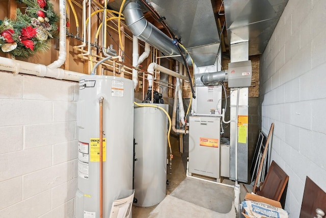 utility room featuring water heater and gas water heater