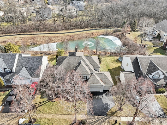 birds eye view of property featuring a residential view and a water view