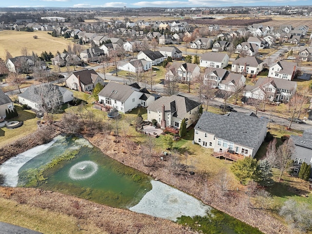 birds eye view of property featuring a water view and a residential view