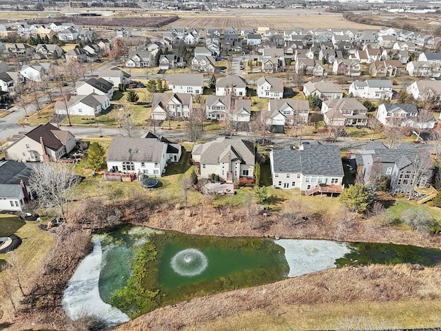 drone / aerial view featuring a water view and a residential view