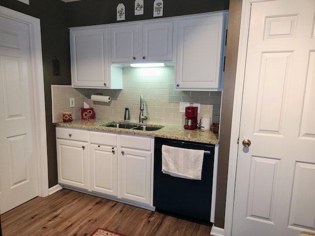 kitchen with dark wood finished floors, white cabinets, dishwasher, and a sink