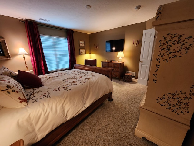 carpeted bedroom with visible vents