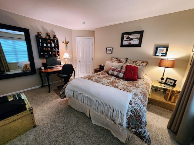 bedroom featuring carpet flooring and baseboards