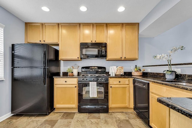 kitchen featuring recessed lighting, a sink, black appliances, and light brown cabinetry