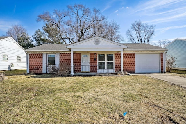 ranch-style house featuring a front yard, brick siding, driveway, and an attached garage