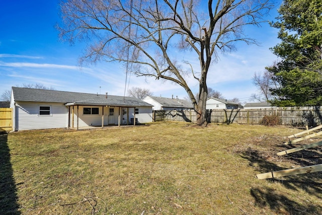 view of yard with a fenced backyard