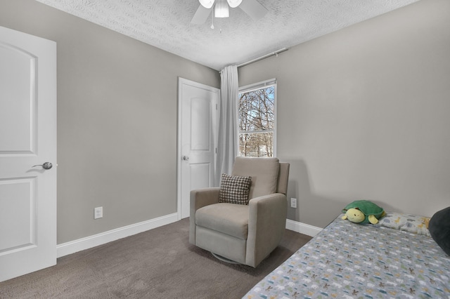 bedroom with a textured ceiling, carpet floors, ceiling fan, and baseboards