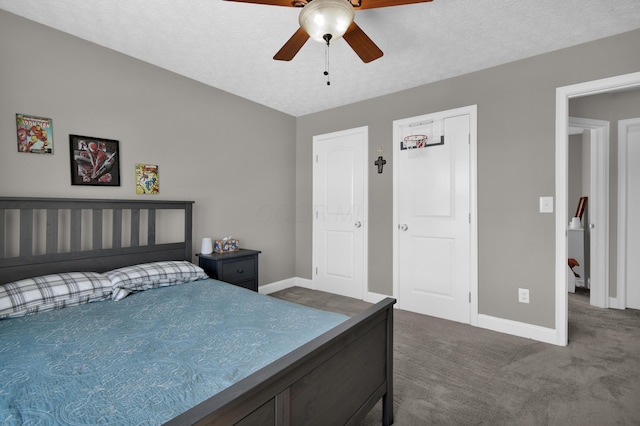 bedroom featuring carpet floors, a textured ceiling, and baseboards