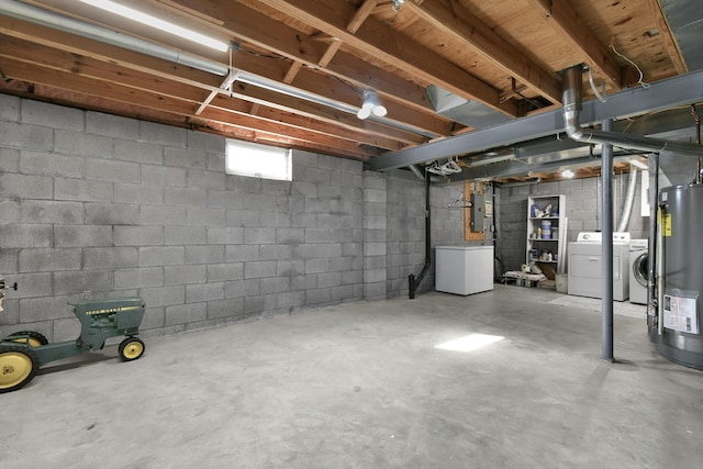 basement with water heater, washing machine and dryer, electric panel, and refrigerator