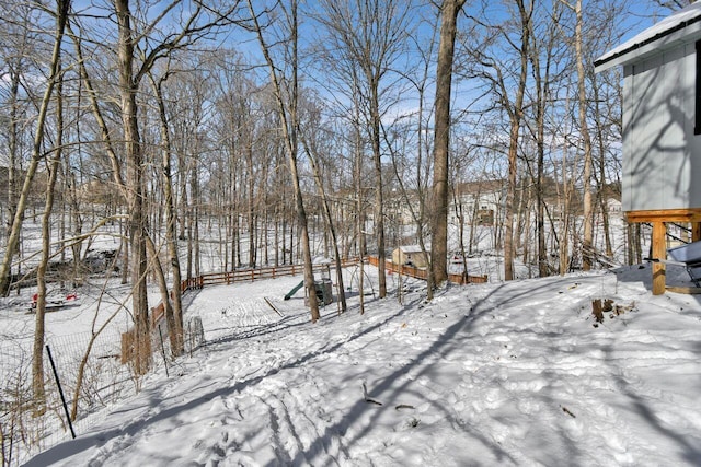 view of yard layered in snow