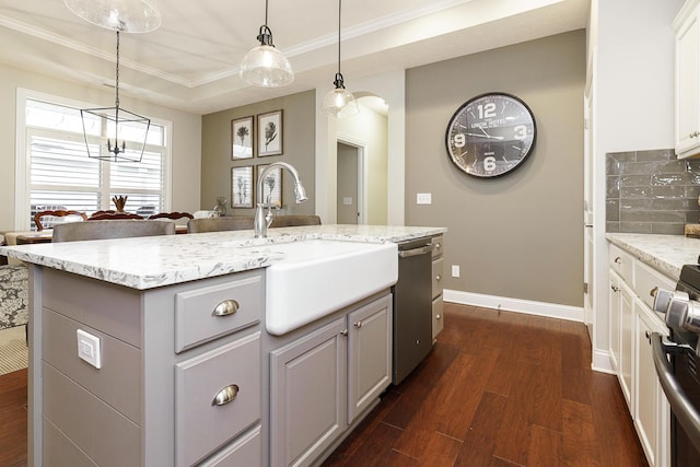 kitchen featuring dark wood-style floors, gray cabinets, stove, a sink, and dishwasher