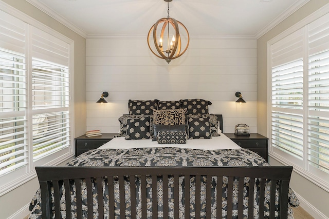 bedroom featuring ornamental molding and an inviting chandelier