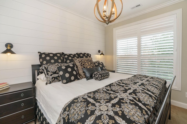 carpeted bedroom featuring ornamental molding, a chandelier, and visible vents