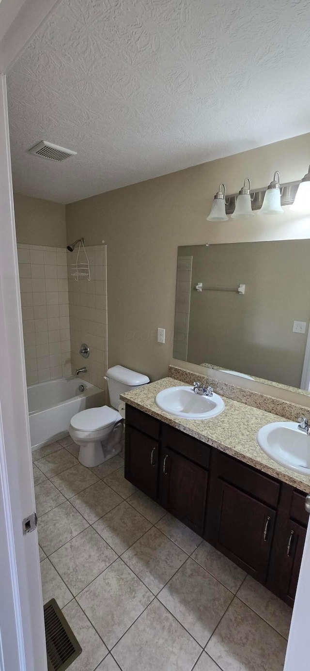 bathroom featuring visible vents, a sink, and toilet