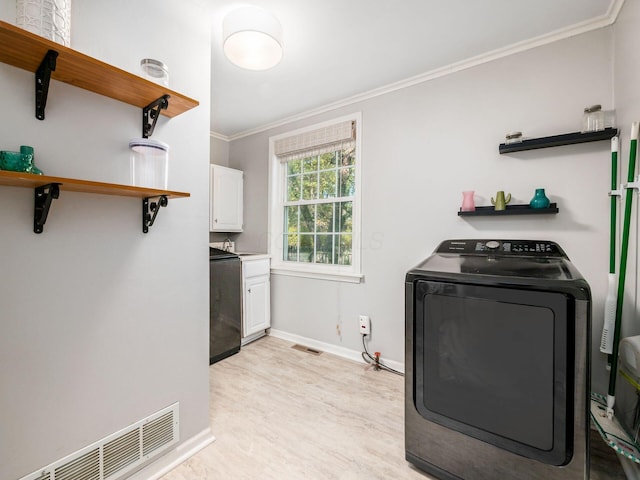 kitchen with crown molding, open shelves, visible vents, white cabinets, and washer / dryer