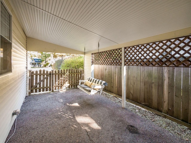 view of patio featuring fence