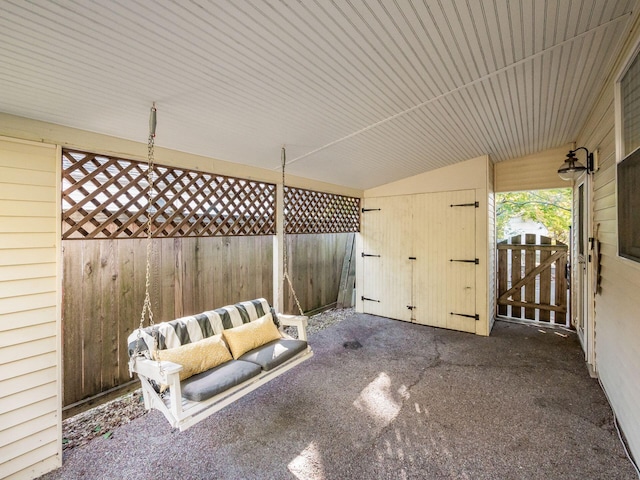 view of patio with a gate and fence