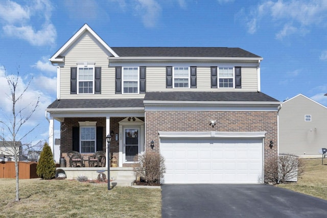 view of front of house with a garage, aphalt driveway, a porch, and brick siding