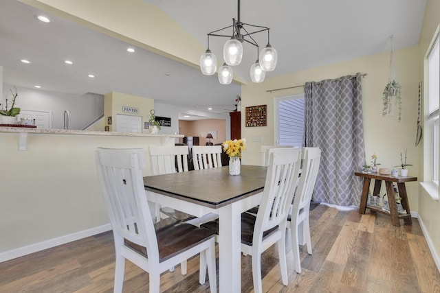 dining space featuring recessed lighting, baseboards, and wood finished floors