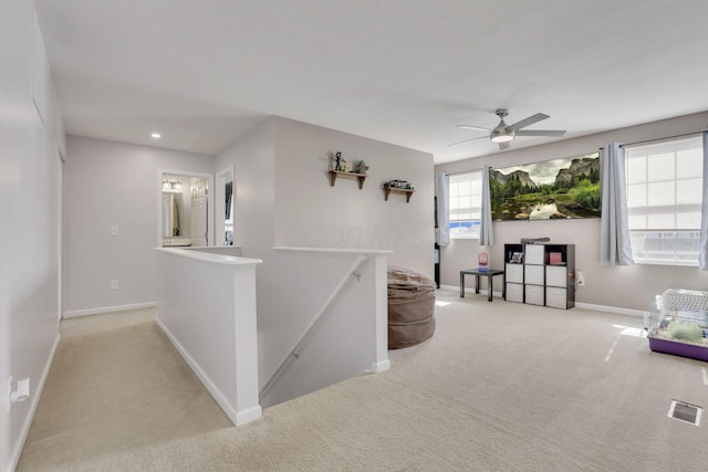 corridor featuring baseboards, visible vents, carpet flooring, an upstairs landing, and recessed lighting