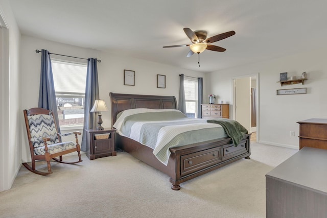 bedroom featuring carpet floors, multiple windows, ceiling fan, and baseboards